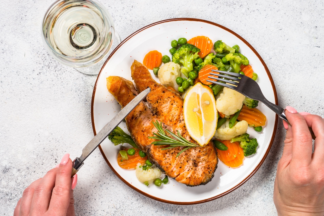 A plate of food with a knife and fork