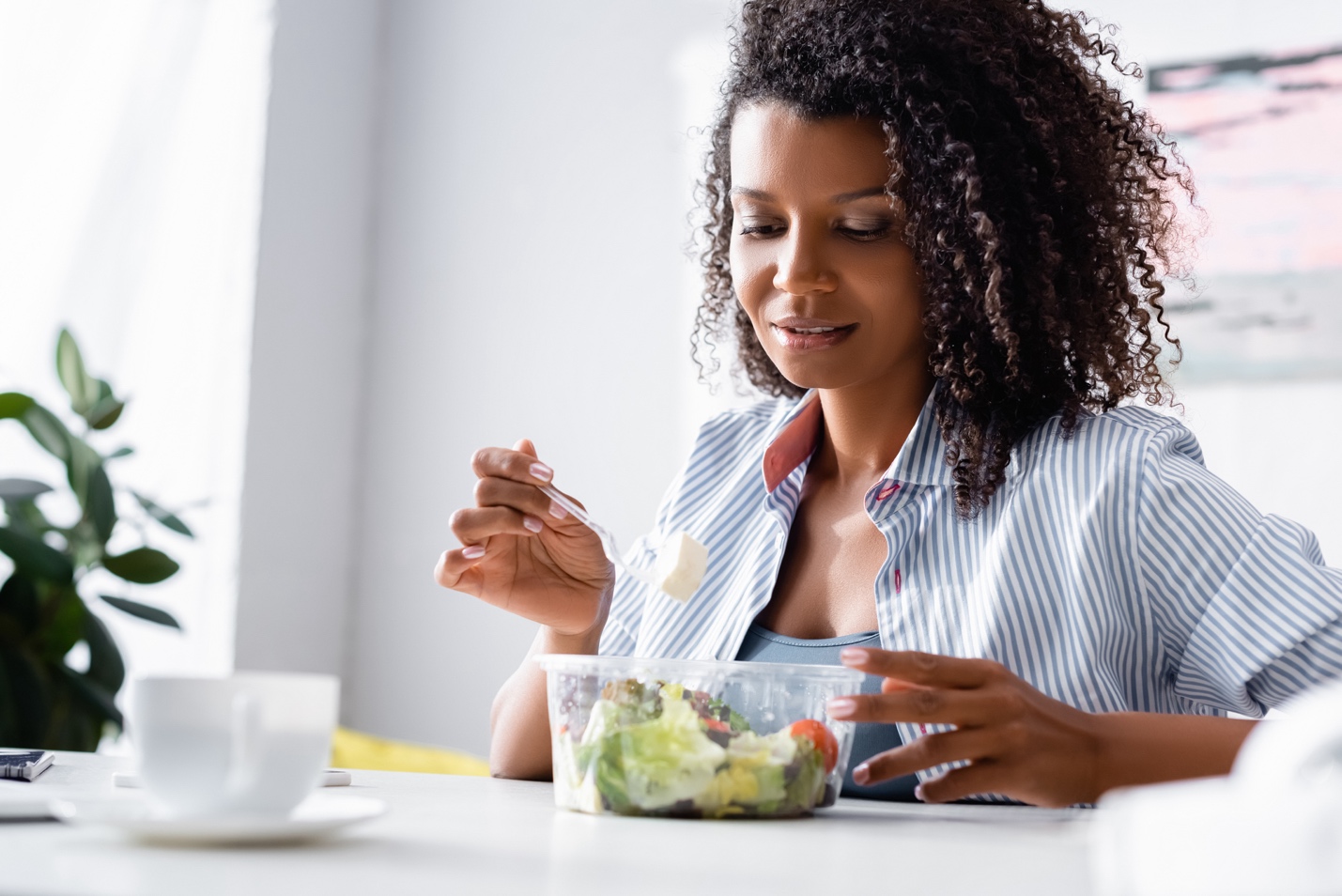 A person mindful eating a salad