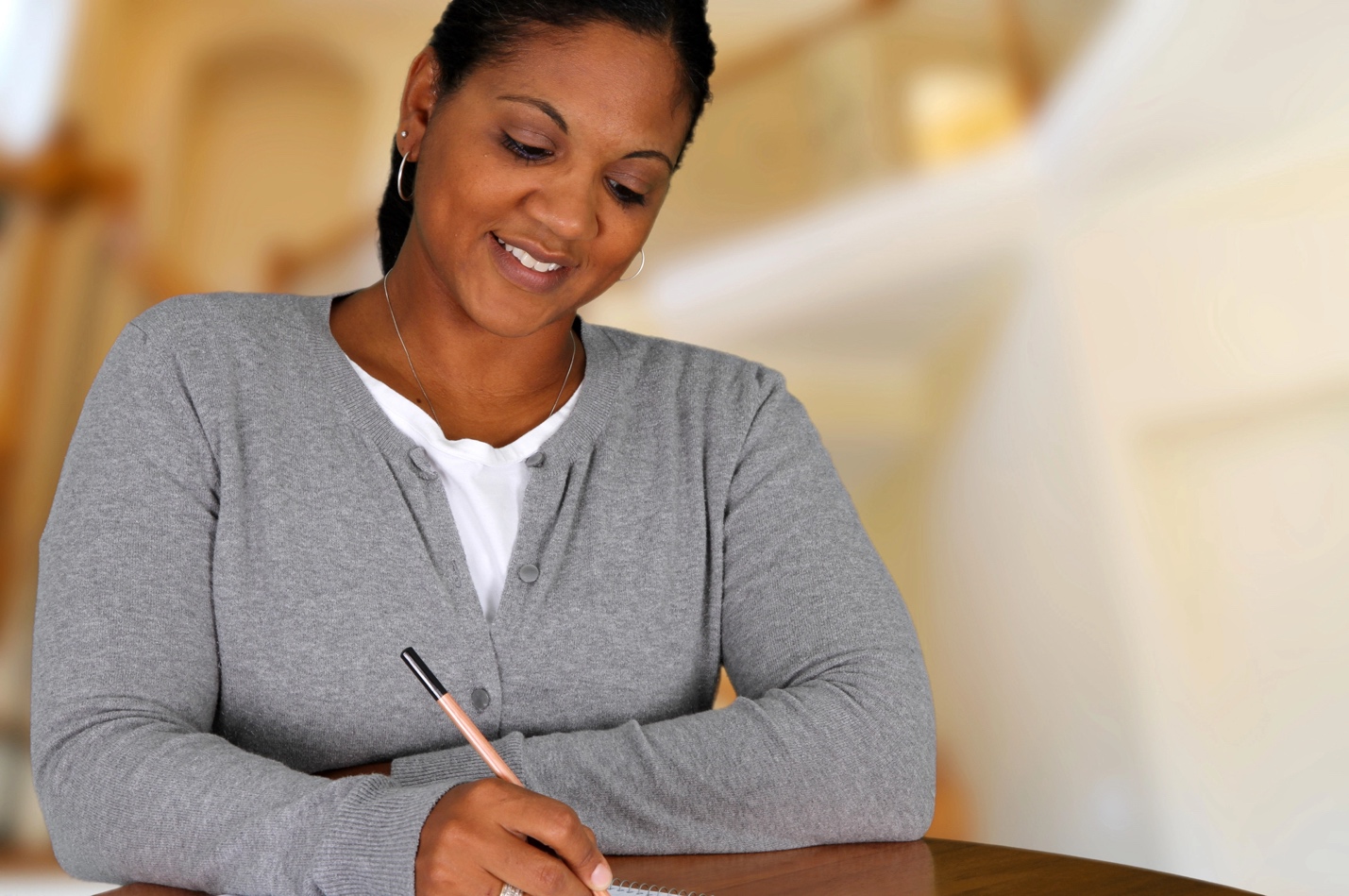 A person journaling in a notebook