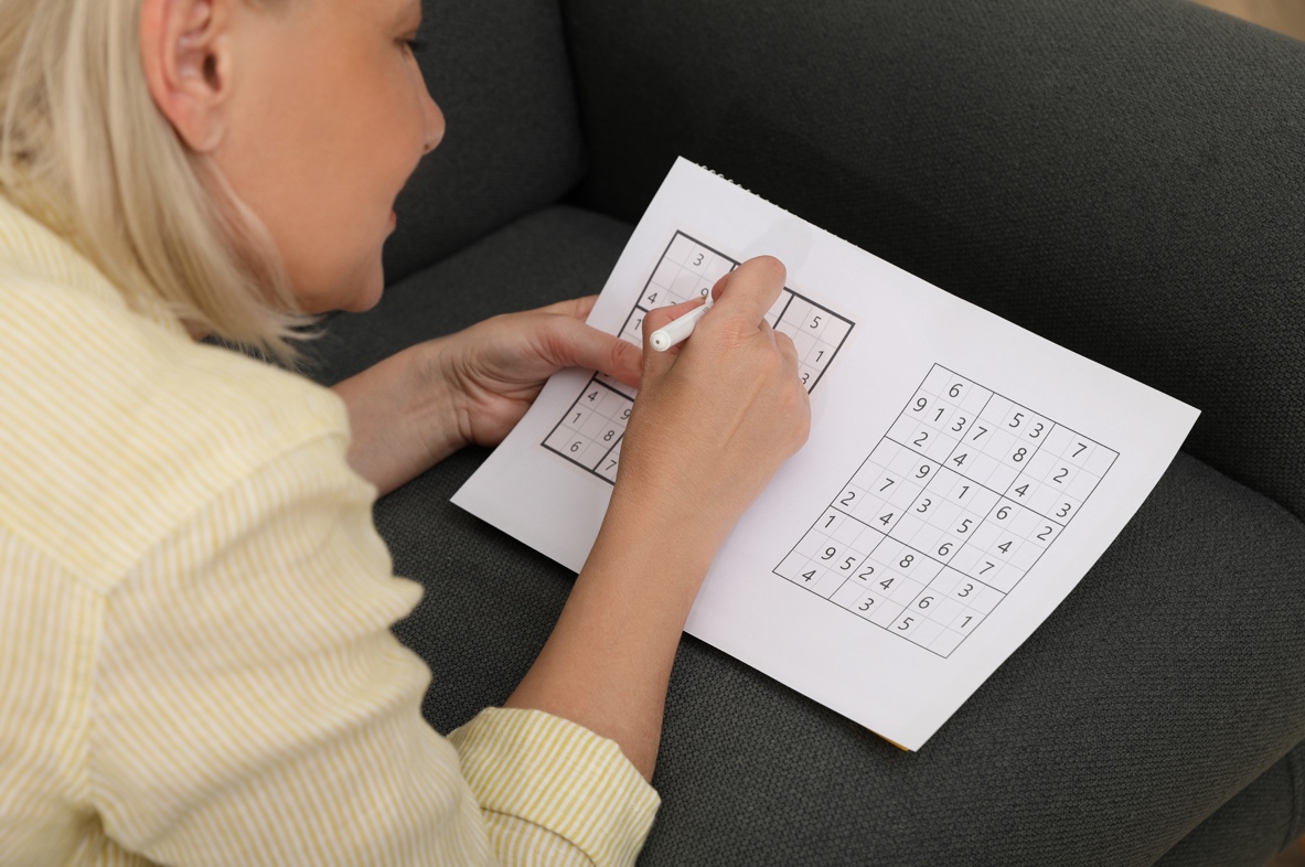 A woman doing sudoku