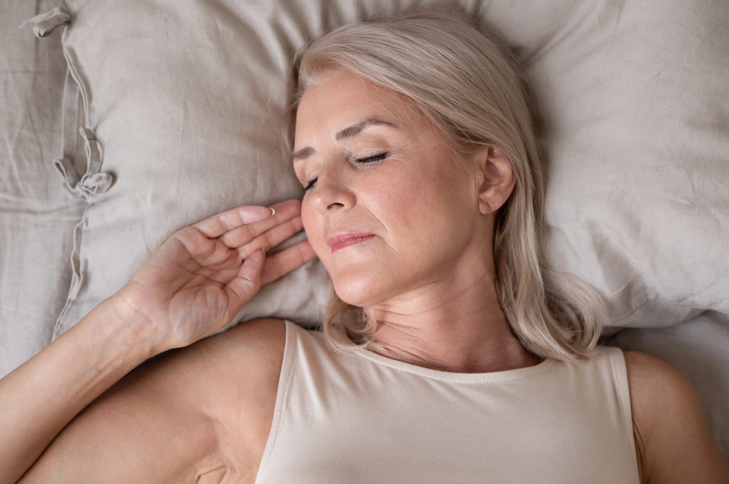 A woman sleeping in bed.